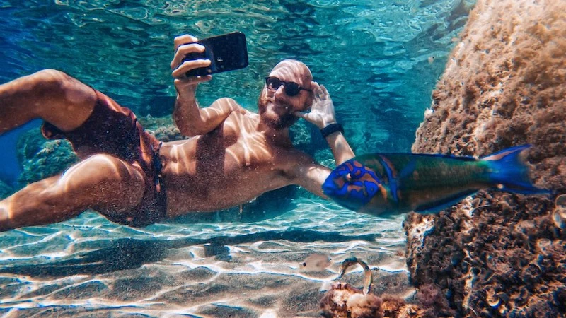 A cool underwater selfie of a man